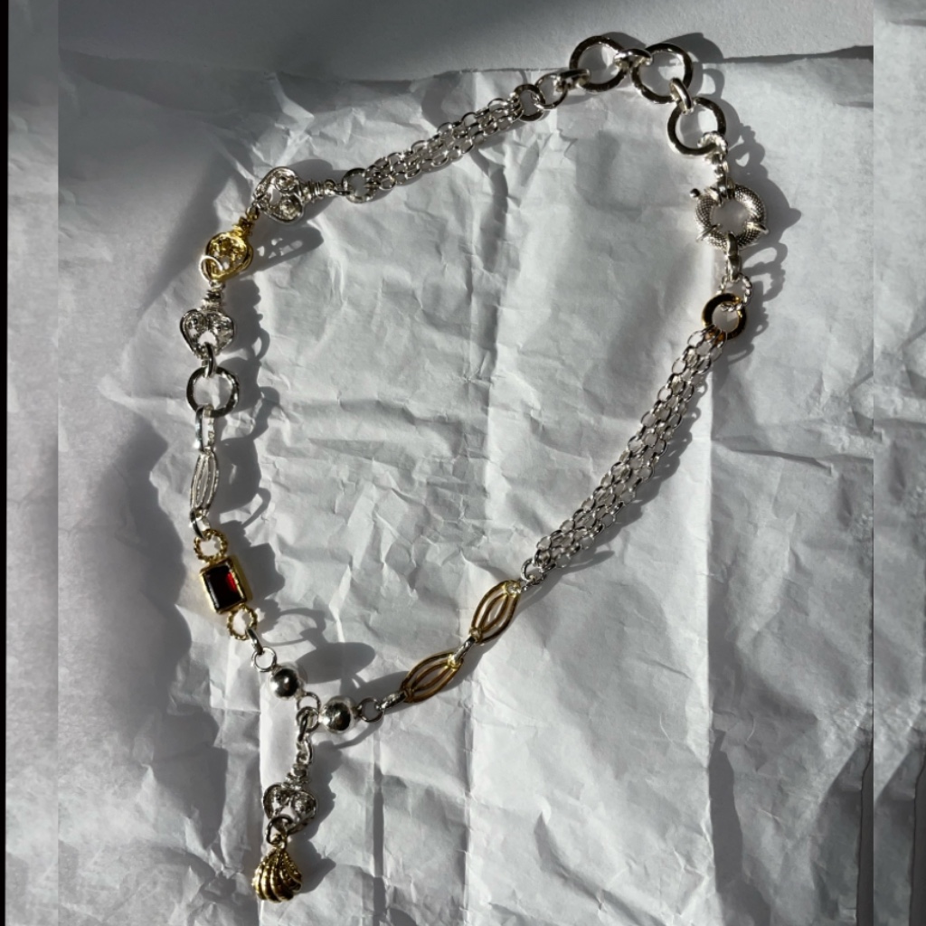 One-of-a-kind chain link with garnet stone